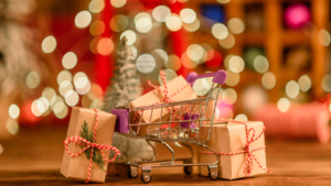 Cart with handmade paper-wrapped Christmas presents promoting shopping local.